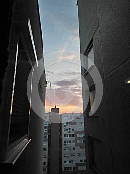 Sunrise city view from between two panel houses after a huge storm in Budapest, Hungary