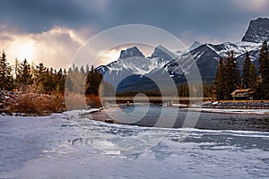 Sunrise Clouds Over A Frozen Mountain River Valley