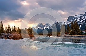 Sunrise Clouds Over An Icy Mountain River Valley