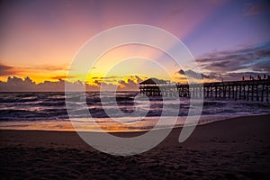 Sunrise at Cocoa Beach pier in Florida