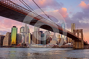 Sunrise colors of Brooklyn Bridge and Manhattan in New York City