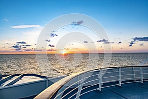 Sunrise at the cruise ship with view to horizon