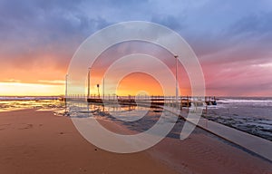 Sunrise and cstorm clouds over Mona Vale Ocean pool