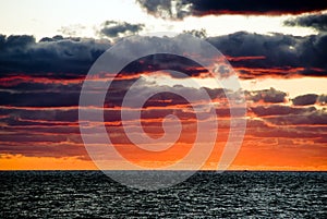 Sunrise with dark dramatic clouds in miami beach