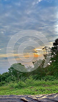 Sunrise at Doi Samerdao cloudy skies with sea of fog. Nan, Thailand.