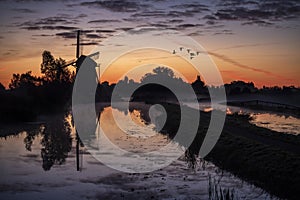 Sunrise on the Dutch windmill