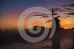 Sunrise on the Dutch windmill