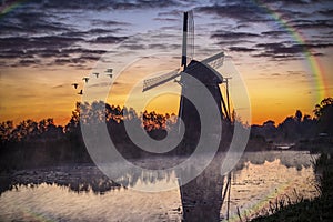 Sunrise on the Dutch windmill