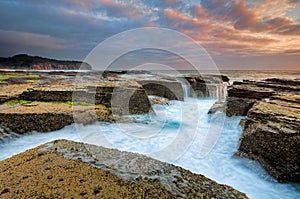 Sunrise from the eroded rocky channel at North Narrabeen