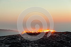 Sunrise at Erta Ale volcano and lava fields