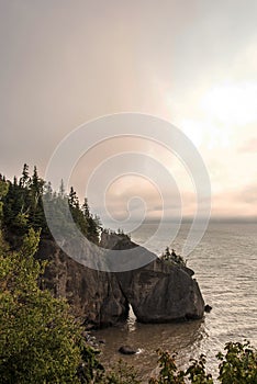 Sunrise famous Hopewell Rocks geologigal formations at low tide biggest tidal wave Fundy Bay New Brunswick Canada