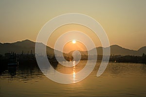 Sunrise and fishing boat at Khanom beach