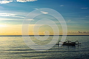 sunrise and fishing boats on sindhu beach, sanur bali