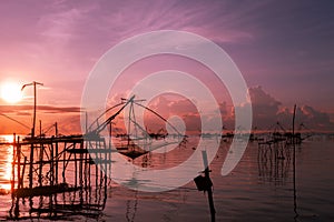 Sunrise with fishing trap in pak pra village, Phatthalung Thaila