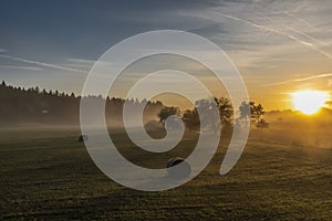 Sunrise with fog on meadows near Pisek town in south Bohemia