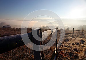 Sunrise with fog over field