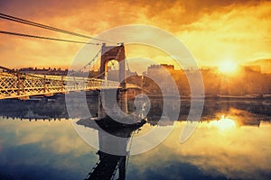 Sunrise on footbridge photo