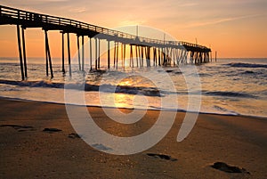 Sunrise and footprints on the Outer Banks, North Carolina