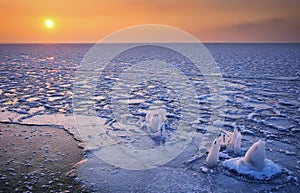 Sunrise and frozen sea. Beautiful winter landscape with lake in morning time. Daybreak