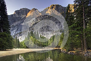 Sunrise on Glacier Point from the Merced river. Yosemite National Park, California, USA photo