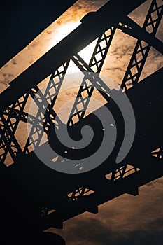 Sunrise glows through Victoria Bridge, a River Metal Railway, Kuala Kangsar