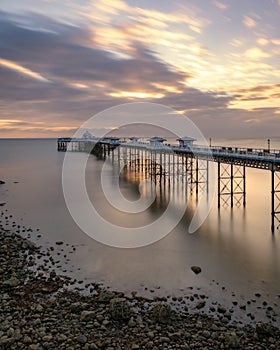 Sunrise golden light over Llandudno Pier in the Victorian seaside resort in North Wales