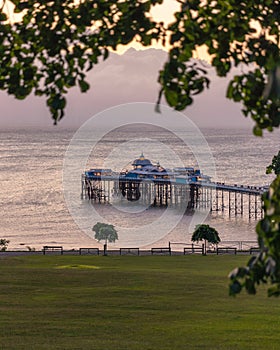 Sunrise golden light over Llandudno Pier in the Victorian seaside resort in North Wales