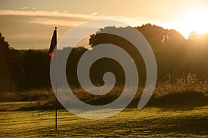 Sunrise Golf Course Putting Green, Autumn Dew on flag