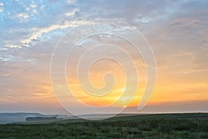 Sunrise and grassland photo