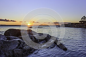 Sunrise in hidden cove at Cattle Point in British Columbia