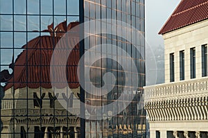 Sunrise highlights glass wall of skyscraper  on Sixth Avenue in Portland