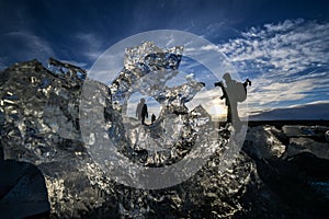 Sunrise with ice, sea and silhouettes