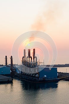 Sunrise at industrial port