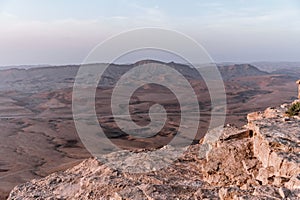 Sunrise in Israel dry negev desert. Amazing view on mountaines, rocks and sky. National park makhtesh ramon