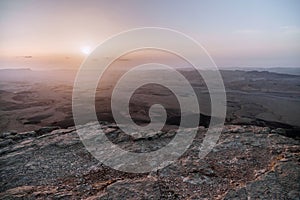 Sunrise in Israel dry negev desert. Amazing view on mountaines, rocks and sky. National park makhtesh ramon