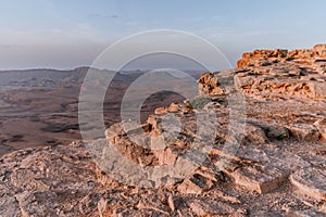 Sunrise in Israel dry negev desert. Amazing view on mountaines, rocks and sky. National park makhtesh ramon