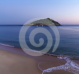 Sunrise in La Concha Bay with Santa Clara Island in the background, city of Donostia-San Sebastian, Basque Country