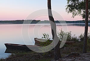 Sunrise on the lake and two boats on the shore (Pisochne ozero,