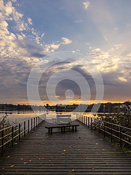 Sunrise and landing stage on the lake Haussee in the city Feldberg, Germany