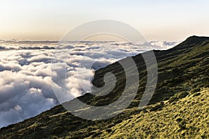 Sunrise landscape with clouds at the northeast coast of Pico Island, Ilha do Pico photo