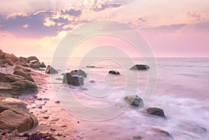 Sunrise landscape over beautiful rocky coastline in the Sea