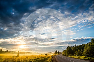 Sunrise landscape of sky, road and field