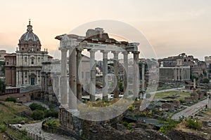 Sunrise landscapes of the empty Roman Forum, view of the Temple of Vespasian and Titus