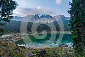 Sunrise landscapes in Lago di Carezza and Latemar Mountain in the background in Welschnofen, South Tyrol, Italy