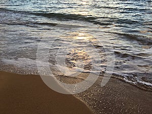 Sunrise Light on Pacific Ocean Waves on Beach in Kapaa on Kauai Island in Hawaii.