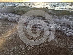 Sunrise Light on Pacific Ocean Waves on Beach in Kapaa on Kauai Island in Hawaii.