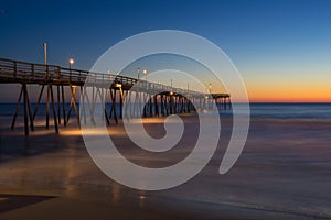 Sunrise on Long Wooden Fishing Pier