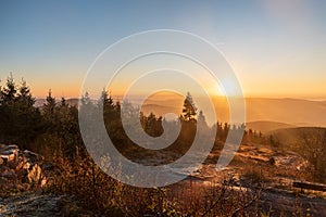 Sunrise from Lysa hora hill in Moravskoslezske Beskydy mountains in Czech republic photo