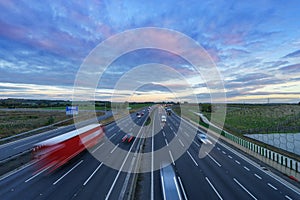 Sunrise at M1 Motorway with cars in motion