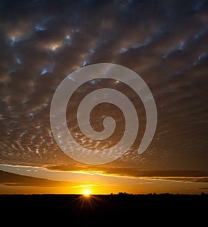 Sunrise and mackerel sky